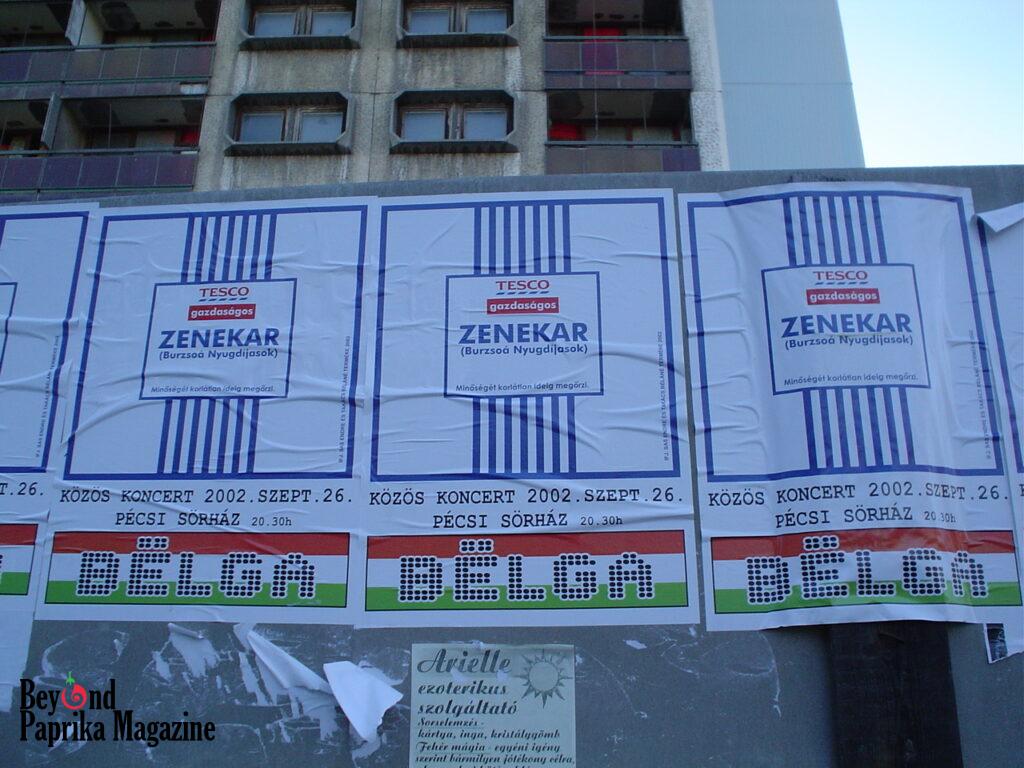 Posters on a wall in Pécs, Hungary (2002), styled after Tesco’s budget-brand packaging, promoting a concert of “Burzsoá Nyugdíjasok” and “Bëlga”